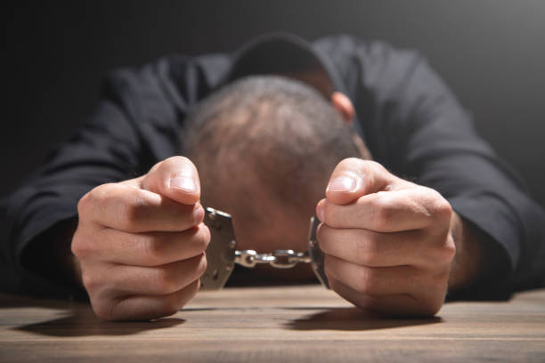 istock Caucasian man in handcuffs. Arrest 1347612778