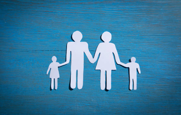 istock Paper cut family on blue background. 1347612984