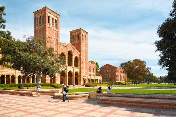 A view of the façades of Royce Hall and Haines Hall at University of California Los Angeles (UCLA) campus. Students are enjoying the sunny day. college stock pictures, royalty-free photos & images