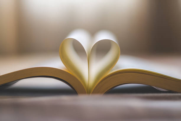 istock Heart book page , love concept 1347616750