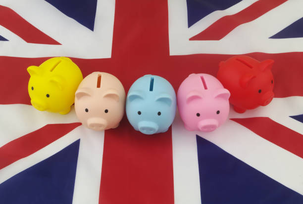 istock Many  piggy banks on British flag 1347616780