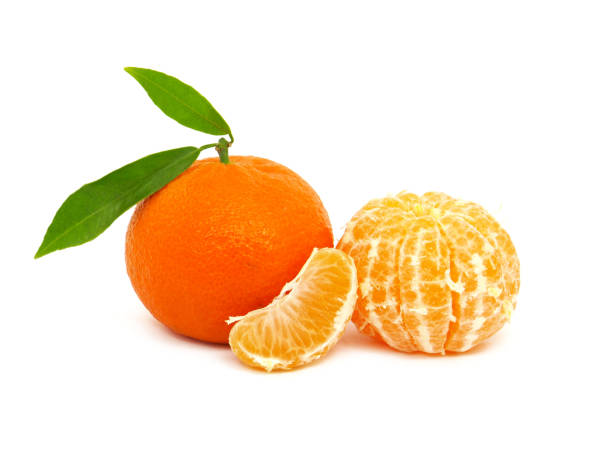 istock Tangerine or clementine with green leaf and slices isolated on white 1347617837