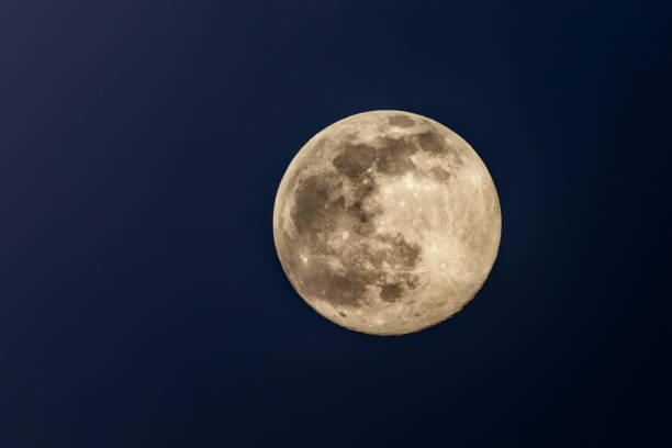 istock Full moon in the dark winter night with clearly visible moon surface during a weak partial eclipse 1347619989