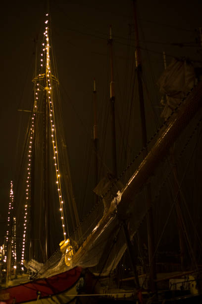 istock Old sailing ships moored on the quay at the river IJssel in Kampen 1347620052