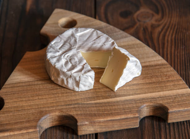 istock Cheese with white mold lies on a cutting board. 1347620057