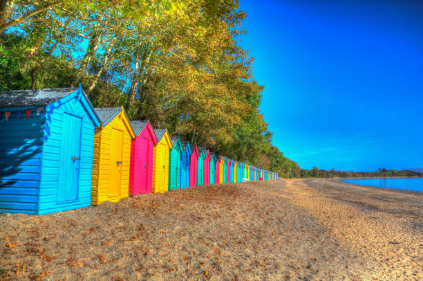 istock Beach huts bright vivid colours in a row blue yellow red 1347622259