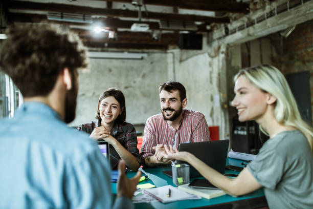 istock Happy start up team having a discussion on a meeting at casual office. 1347624401