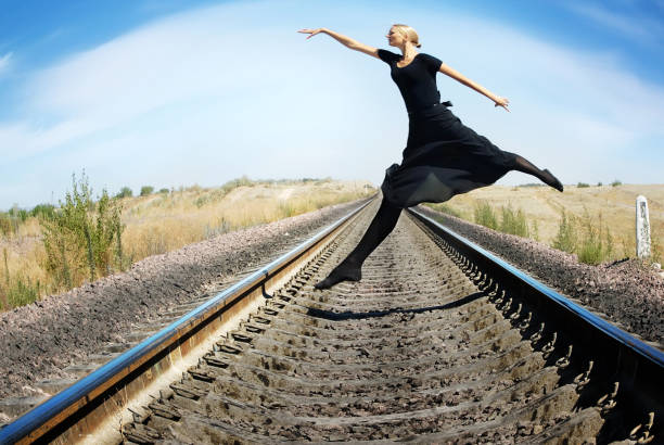 Wide-angle photo of ballet dancer jumping