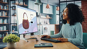 latina-female-using-desktop-computer-with-clothing-online-web-store-um-kleidung-aus-der-neuen.jpg?b=1&s=170x170&k=20&c=4HWlqu0OsHn5GXsgaJSoeSDQaijyfJJY8u8TRijJOds=