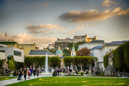 Famous Mirabell Gardens sunset view with historic Fortress in Salzburg, Austria