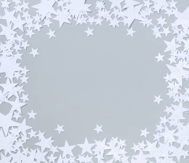 istock background with confetti frame of white stars 1347635479