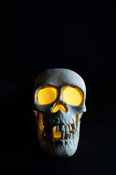 istock human skull with yellow eyeballs 1347636068
