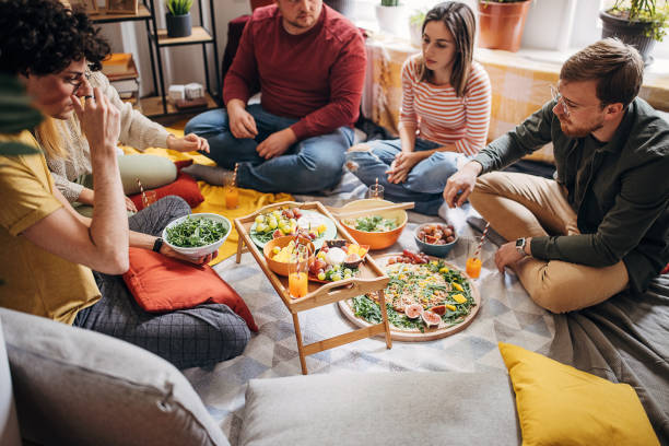 istock Friends eating together 1347636109