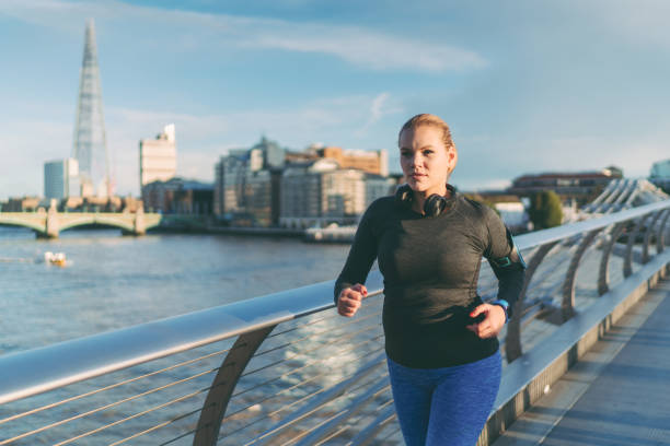 istock Woman jogging in London 1347638551