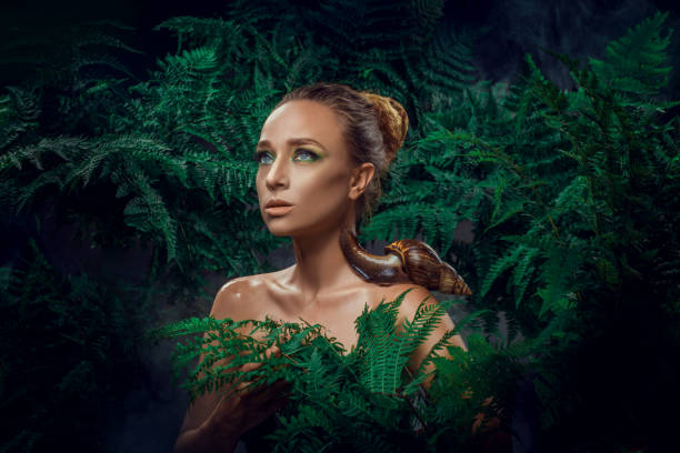 istock Mother Nature figure with snails 1347639892
