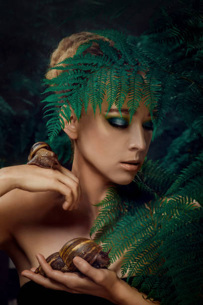istock Mother Nature figure with snails 1347639917