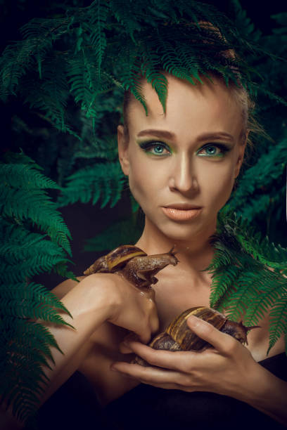 istock Mother Nature figure with snails 1347639937