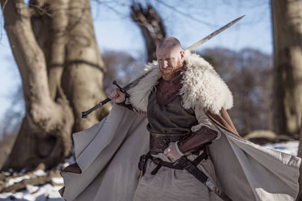 istock Viking warrior king in a snowy forest 1347640883
