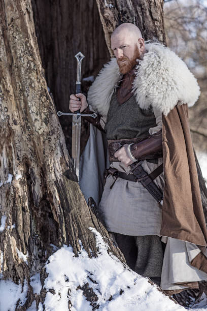 istock Viking warrior king in a snowy forest 1347640952