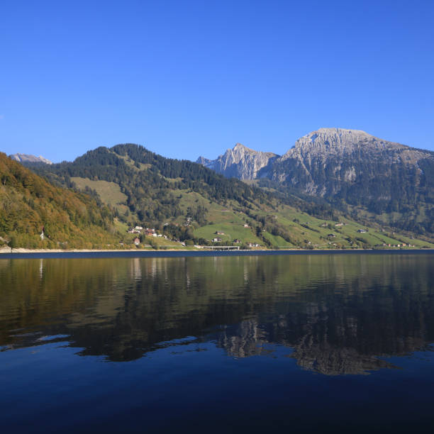 istock Mountain landscape reflecting in Lake Waegital. 1347642345