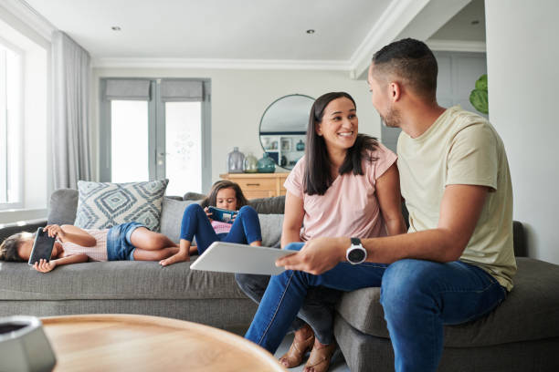 istock Shot of a young couple using a digital tablet at home 1347642507