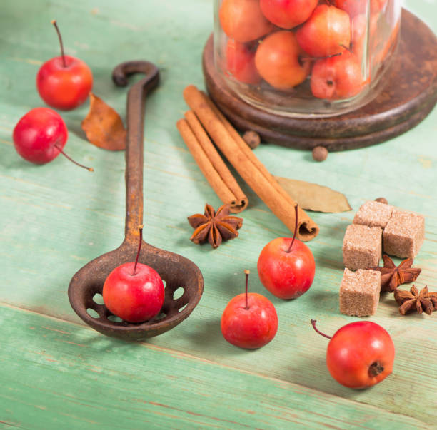 istock paradise apples, on the wooden table in the rustic style, iron mug 1347643167