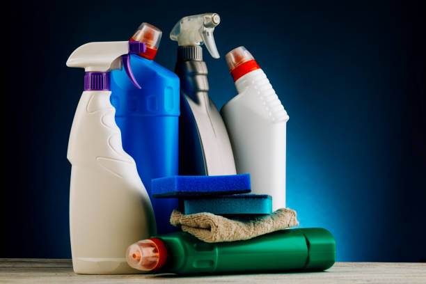 istock Various bottles of cleaning products on a blue background 1347645358