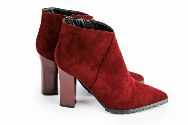 istock Burgundy female leather warm boots isolated on white background 1347645583