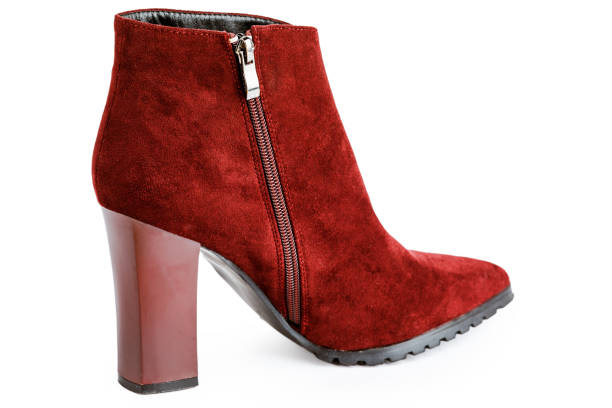 istock Burgundy female leather warm boots isolated on white background 1347645587