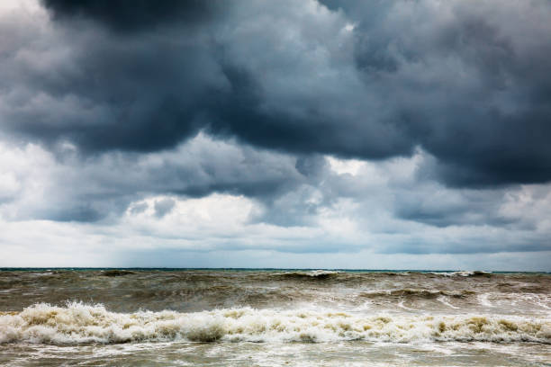 istock Storm clouds over the sea. Dramatic sky and giant waves. 1347646130