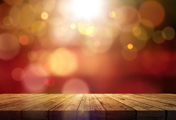 istock 3D wooden table against a bokeh lights background 1347648987