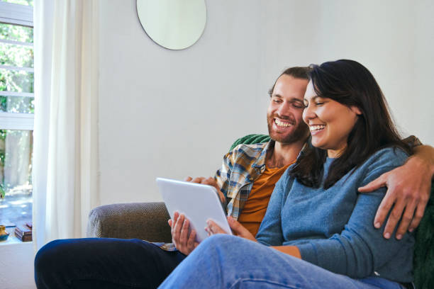 istock Shot of a young couple using their digital tablet together 1347650365