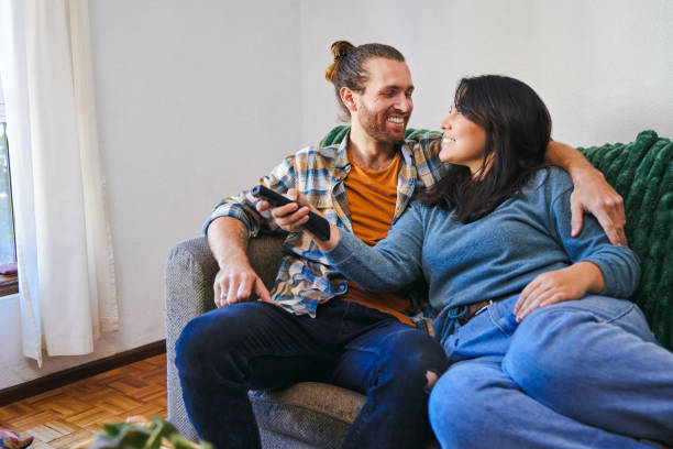istock Shot of a young couple spending time together while watching TV 1347650564