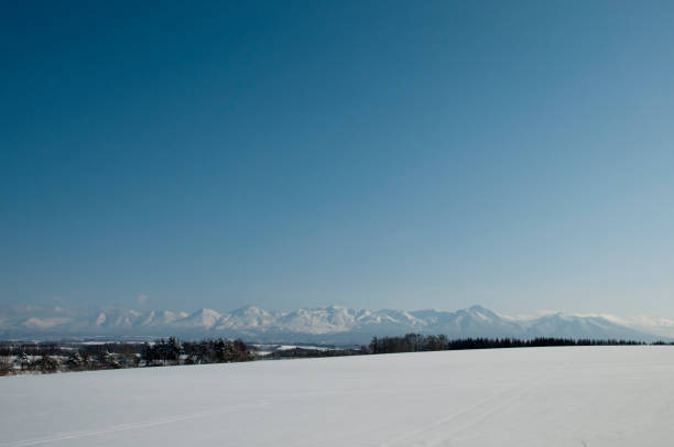 istock Snow fields and snow mountains with a blue sky 1347651567
