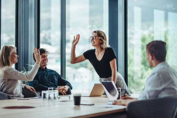 istock Corporate professionals celebrating success in meeting 1347652191
