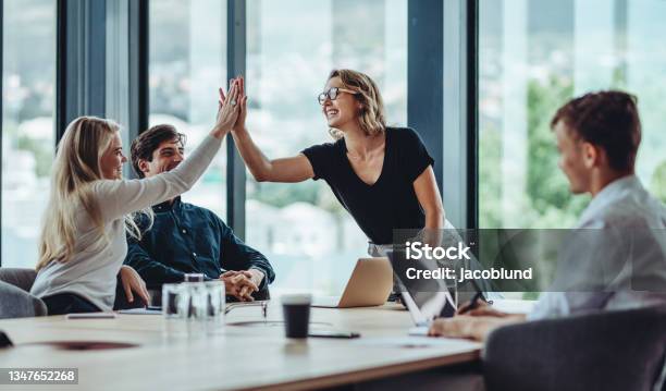 Group Of Colleagues Celebrating Success Stock Photo - Download Image Now - Teamwork, Business, Happiness