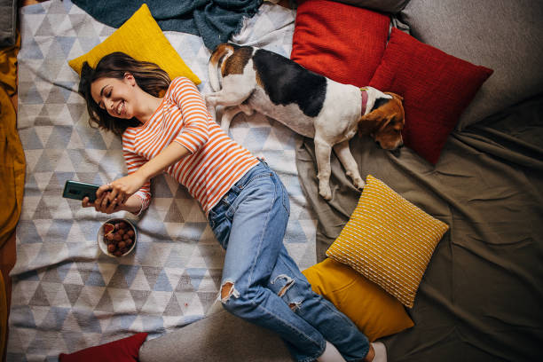 istock Woman relaxing with dog 1347653471