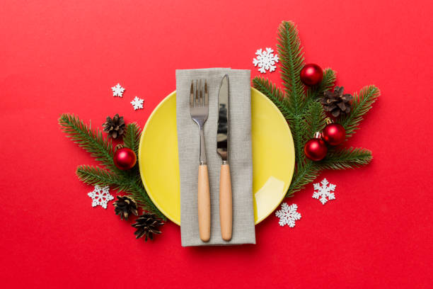 istock Christmas table place setting with christmas decor and plates, kine, fork and spoon. Christmas holiday background. Top view 1347655298
