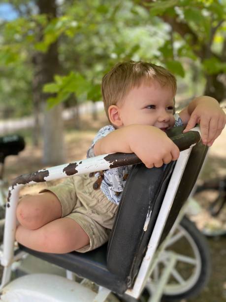 istock Little boy sitting on the old retro bicycle 1347657870