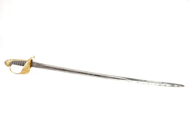 Used by the navy from 1846, this type of sabre has a gilded brass hilt, shagreen grip and steel blade. The scabbard is leather and brass.