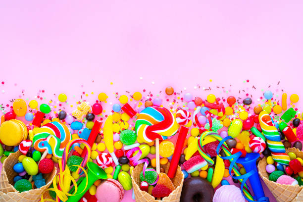 istock Sugar candies border on pink background 1347659211