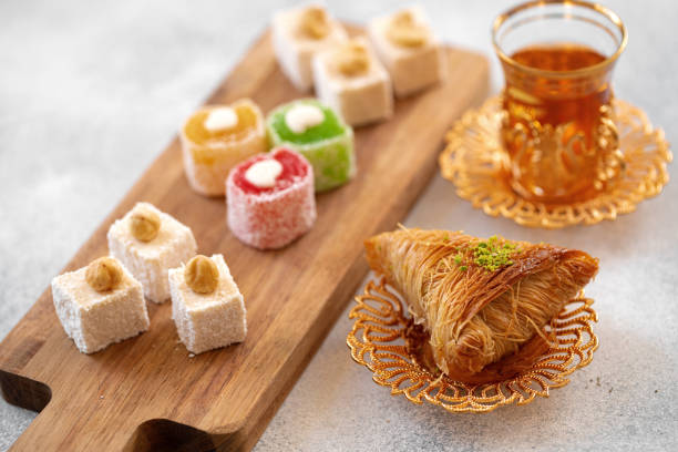 istock Various Turkish sweets and cup of tea on white textured background 1347659861