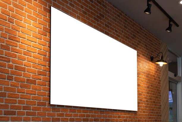 istock perspective blank white poster and brick wall background.  The white mock-up on the wall for advertisement in restaurant shop. 1347660043