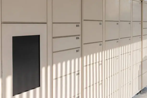 Photo of smart locker with blank monitor. electronic steel parcel locker, automatic mailboxes.