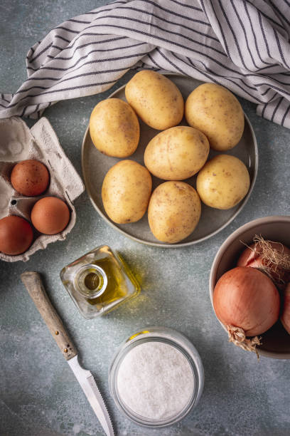 istock potatos, eggs, onions, olive oil and salt 1347660569