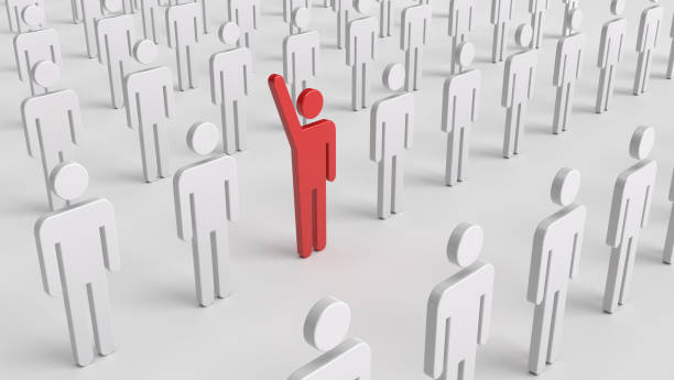 istock A red symbolic man standing out among others 1347660797