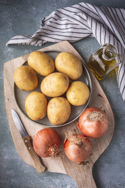istock potatoes, onions and olive oil 1347662212