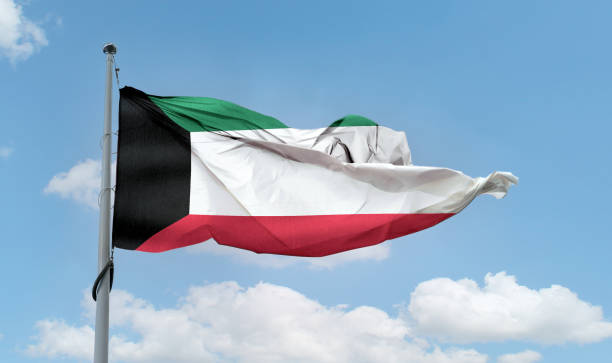 istock Kuwait flag - realistic waving fabric flag. 1347664929