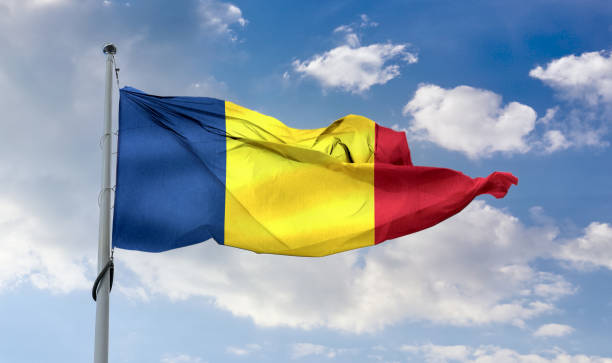 istock Romania flag - realistic waving fabric flag 1347665245