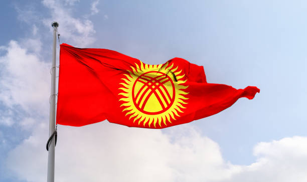 istock Kyrgyzstan flag - realistic waving fabric flag. 1347665656